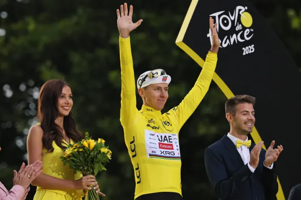 epa12266499 Slovenian rider Tadej Pogacar of UAE Team Emirates wearing the yellow jersey for overall leader celebrates on the podium his victory after the 21st and last stage of the Tour de France cycling race over 132.3km from Mantes-la-Ville to Paris, France, 27 July 2025. EPA/CHRISTOPHE PETIT TESSON