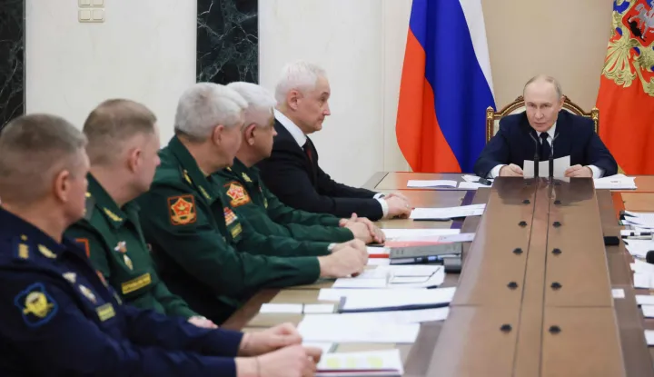 In this pool photograph distributed by the Russian state agency Sputnik, Russia's President Vladimir Putin chairs a meeting on situation in the zone of the "special military operation", the Kremlin's term for the nearly four-year-long Ukraine offensive, in Moscow on December 29, 2025. (Photo by Mikhail METZEL/POOL/AFP)