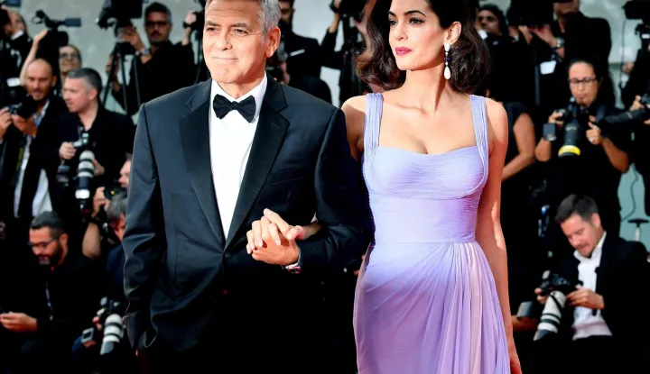 epa06479139 (FILE) - US film director George Clooney with his wife British human rights barrister Amal Alamuddin Clooney arrive for the premiere of 'Suburbicon' during the 74th Venice Film Festival in Venice, Italy, 02 September 2017 (reissued 27 January 2018). Amal Clooney turns 40 on 03 February 2018. EPA/ETTORE FERRARI *** Local Caption *** 53743681