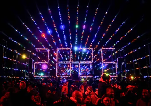 Revellers watch a fireworks and light show for children on Museumplein as part of New Year's Eve celebrations in Amsterdam on December 31, 2025. (Photo by Remko de Waal/ANP/AFP)/Netherlands OUT