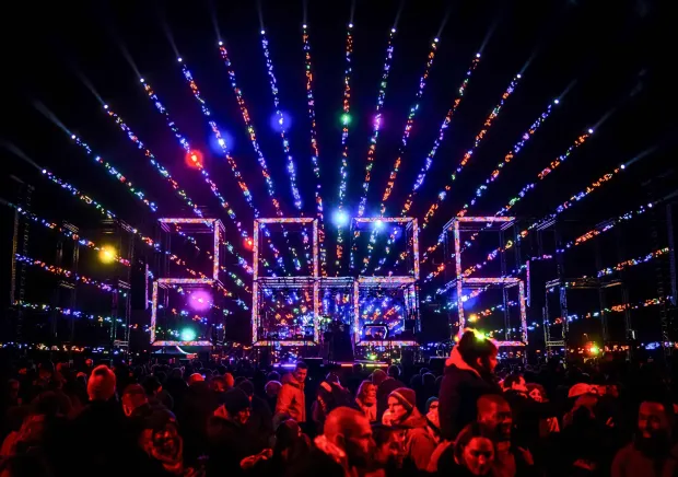 Revellers watch a fireworks and light show for children on Museumplein as part of New Year's Eve celebrations in Amsterdam on December 31, 2025. (Photo by Remko de Waal/ANP/AFP)/Netherlands OUT