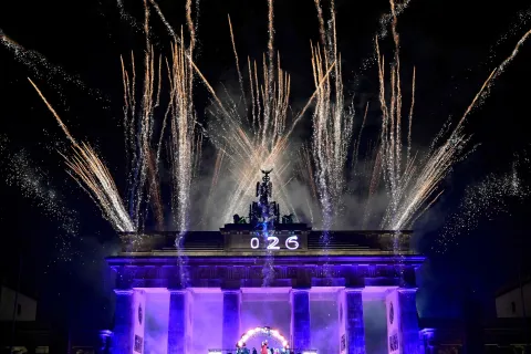 Fireworks explode over Berlin's landmark the Brandenburg Gate during festivities titled "Yeah 26" to celebrate the New Year, in Berlin, on January 1, 2026. (Photo by John MACDOUGALL/AFP)
