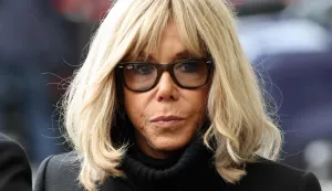 (FILES) French President's wife Brigitte Macron arrives ahead of the ceremony outside "La Belle Equipe" bar in Paris on November 13, 2025 during ceremonies across Paris marking a decade since the terror attacks of November 13, 2015 in which 130 civilians were killed. The verdict for the case of 10 people accused of the cyber-harassment of French President's wife is set for January 5, 2026. (Photo by Ludovic MARIN/POOL/AFP)