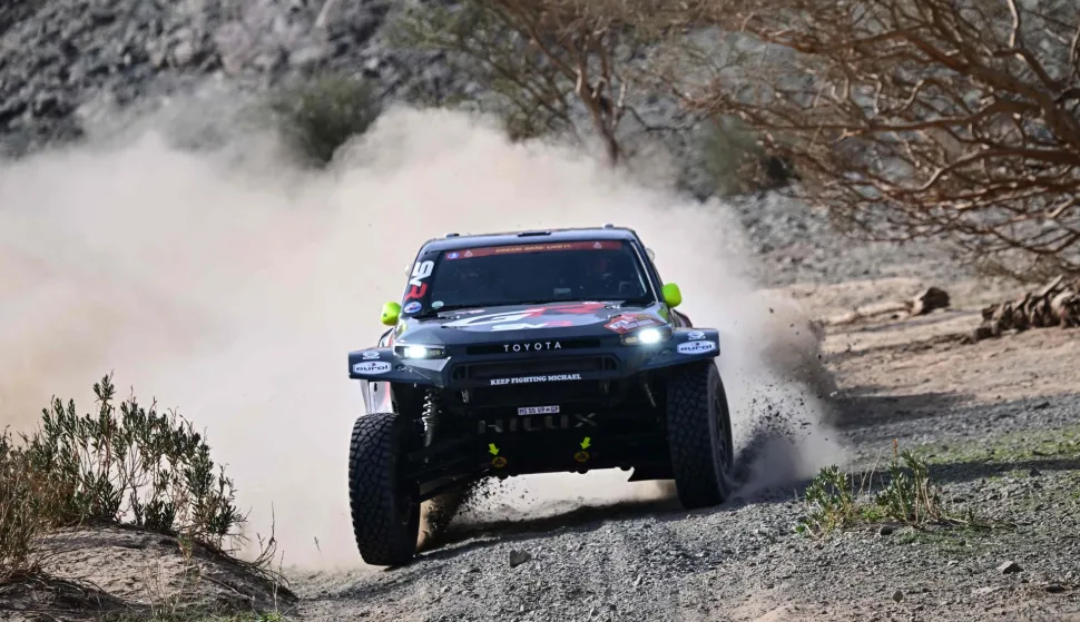 Toyota Gazoo Racing SA's South African driver Guy Botterill and his Spanish co-driver Oriol Mena compete in Stage 2 of the 48th edition of the Dakar Rally, between Yanbu and Al Ula in Saudi Arabia, on January 5, 2026. (Photo by Giuseppe CACACE/AFP)