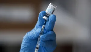 epa10104694 Healthcare worker Gizelle Mendoza prepares a syringe with a dose of the Monkeypox vaccine, at a vaccination clinic at the West Hollywood Library, in West Hollywood, California, USA, 03 August 2022. Pop-up vaccination clinics have emerged across Los Angeles County, making vaccinations availble only for specific risk groups while supplies are limited. EPA/CAROLINE BREHMAN