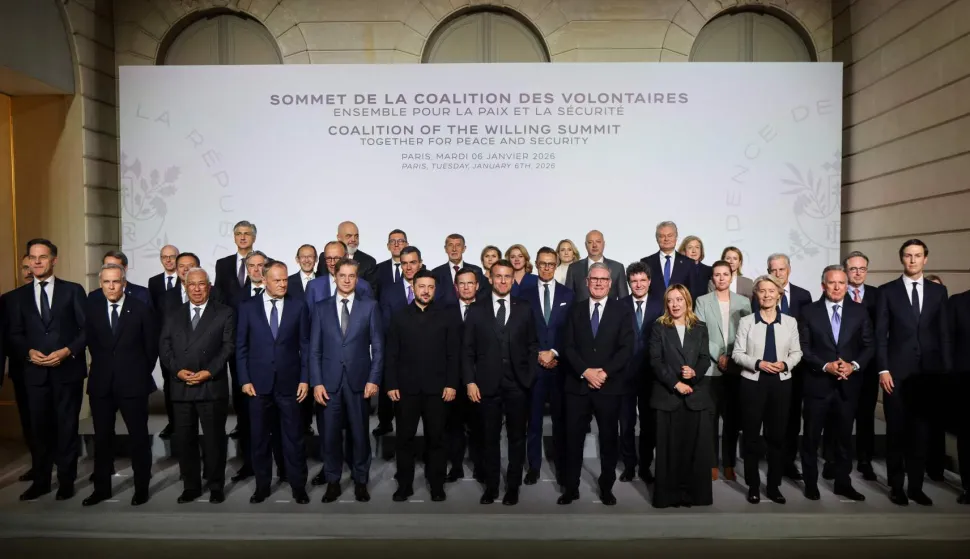 (Front row from L) Cyprus's Minister of Energy, Commerce and Industry Michael Damaianos, NATO Secretary General Mark Rutte, Canada's Prime Minister Mark Carney, European Council President Antonio Costa, Poland's Prime Minister Donald Tusk, Slovenia's Prime Minister Robert Golob, Ukraine's President Volodymyr Zelensky, France's President Emmanuel Macron, Britain's Prime Minister Keir Starmer, Italy's Prime Minister Giorgia Meloni, European Commission President Ursula Von der Leyen,US Special Envoy Steve Witkoff, US President's son-in-law and businessman Jared Kushner and US Ambassador to France Charles Kushner (back row) Croatia's Prime Minister Andrej Plenkovic, Albania's Prime Minister Edi Rama, Spain's Prime Minister Pedro Sanchez, Sweden's Prime Minister Ulf Kristersson, Finland's President Alexander Stubb, Romania's President Nicusor Dan, Denmark's Prime Minister Mette Frederiksen and Belgium's Prime Minister Bart De Wever pose for a family photo at the Elysee Palace in Paris, on January 6, 2026, on the sideline of the Coalition of the Willing summit on security guarantees for Ukraine. The summit of the group of Ukraine supporters dubbed the "Coalition of the Willing" is the latest of several meetings planned for the new year as diplomatic efforts to end Europe's deadliest conflict since World War II have gained pace in recent weeks. (Photo by Ludovic MARIN/POOL/AFP)