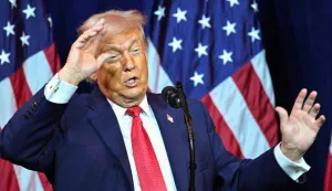 US President Donald Trump reacts as he speaks during the House Republican Party (GOP) member retreat at the Kennedy Center in Washington, DC, on January 6, 2026. (Photo by Mandel NGAN/AFP)