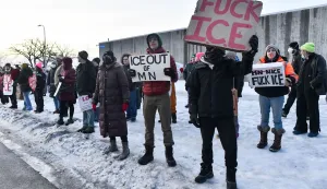 EDITORS NOTE: Graphic content/Protestors gather outside the Bishop Henry Whipple Federal Building in Saint Paul, Minnesota, on January 8, 2026. A US Immigration and Customs Enforcement (ICE) agent shot and killed an American woman on the streets of Minneapolis January 7, leading to huge protests and outrage from local leaders who rejected White House claims she was a domestic terrorist. The woman, identified in local media as 37-year-old Renee Nicole Good, was hit at point blank range as she apparently tried to drive away from agents who were crowding around her car, which they said was blocking their way. (Photo by Octavio JONES/AFP)