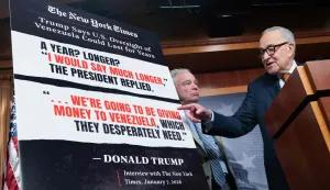 US Senate Minority Leader Chuck Schumer (R), Democrat of New York, speaks alongside Senator Tim Kaine (L), Democrat of Virginia, during a press conference after a US Senate vote on a War Powers Resolution blocking further US military action in Venezuela at the US Capitol in Washington, DC, January 8, 2026. The US Senate took a major step Thursday toward passing a resolution to rein in President Donald Trump's military actions in Venezuela -- a rare bipartisan rebuke following alarm over the secretive capture of leader Nicolas Maduro. The Democratic-led legislation, which bars further US hostilities against Venezuela without explicit congressional authorization, got through a key procedural vote with support from five Republicans. (Photo by SAUL LOEB/AFP)