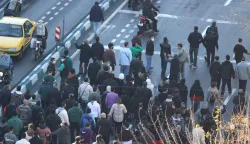 Shopkeepers and traders protest in the street against the economic conditions and Iran's embattled currency in Tehran on December 29, 2025. Some shopkeepers in Tehran closed their stores on December 29 in protest against economic hardships and sharp swings in Iran's embattled currency, Iranian media reported, following similar demonstrations a day earlier. Iran's currency has hit new lows on the unofficial market, with the US dollar trading at around 1.42 million rials on Sunday, compared to 820,000 rials a year ago and the euro nearing 1.7 million rials, according to price monitoring websites. (Photo by HANDOUT/FARS NEWS AGENCY/AFP)