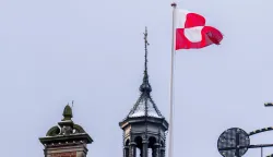 The Greenlandic flag (Erfalasorput) flies on the roof of Tivoli Castle in Copenhagen, on January 8, 2026. US President Donald Trump is discussing options including military action to take control of Greenland, the White House said on January 6, 2025, upping tensions that Denmark warns could destroy the NATO alliance. Trump has stepped up his designs on the mineral-rich, self-governing Danish territory in the arctic since the US military seized Venezuelan leader Nicolas Maduro on January 3, 2026. (Photo by Ida Marie Odgaard/Ritzau Scanpix/AFP)/Denmark OUT