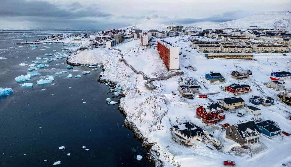 (FILES) This aerial view shows snow-covered buildings in Nuuk, Greenland, on March 7, 2025. Any US attack on a NATO ally would be the end of "everything", Denmark's Prime Minister Mette Frederiksen warned on January 5, 2026, after US President Donald Trump repeated his desire to annex Greenland. "If the United States decides to militarily attack another NATO country, then everything would stop -- that includes NATO and therefore post-World War II security," Frederiksen told Danish television network TV2. (Photo by Odd ANDERSEN/AFP)