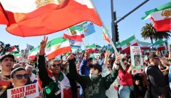 Activists take part in a ?Free Iran? rally in Los Angeles, California, on January 11, 2026. The Norway-based NGO Iran Human Rights (IHR) said it had confirmed the killing of at least 192 protesters but warned the actual death toll could already amount to several hundreds, or even more. The IHR has an extensive network of sources in the country. The protests, initially sparked by anger over the rising cost of living, have evolved into a movement against the theocratic system in place in Iran since the 1979 revolution. They have already lasted two weeks. (Photo by Jonathan Alcorn/AFP)