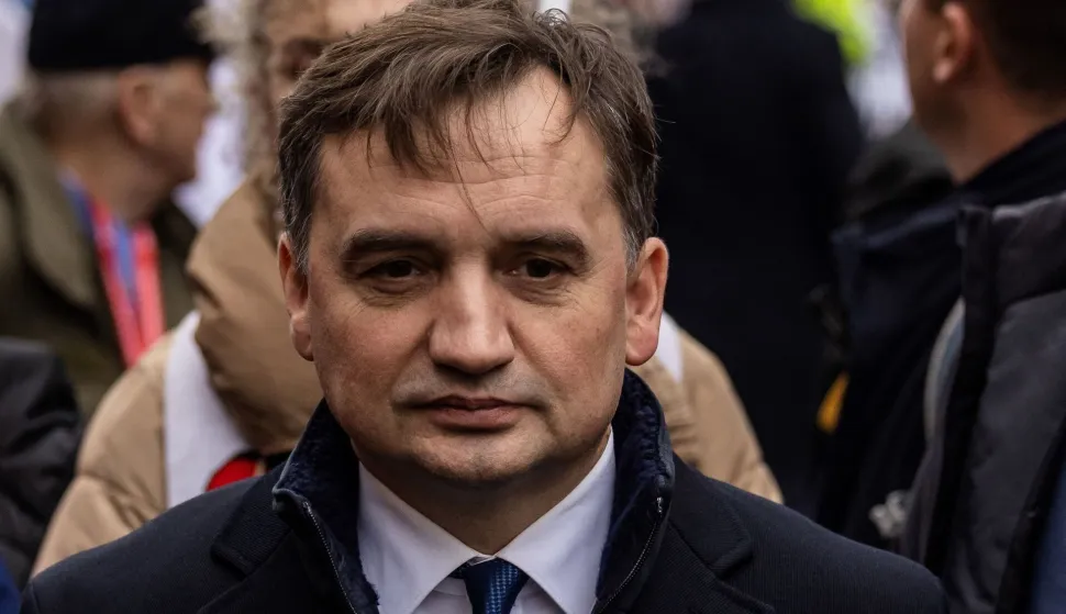 Picture taken on November 11, 2022 in Warsaw, Poland, shows then Polish Justice Minister Zbigniew Ziobro during an Independence Day march organised by nationalist groups. Ziobro, who faces criminal charges including misappropriating funds meant for crime victims to illegally purchase Israeli spyware, said on January 12, 2026 he had received "asylum" in Hungary. Hungarian Foreign Minister Peter Szijjarto confirmed Budapest had granted "asylum or refugee status to individuals suffering political persecution in Poland", without naming the individuals concerned. Polish conservative former justice minister Zbigniew Ziobro served from 2015 to 2023 in the government of the populist-nationalist Law and Justice (PiS) party, a close ally of Hungarian Prime Minister Viktor Orban. (Photo by Wojtek RADWANSKI/AFP)