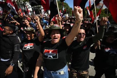 Members of the Marxist-Leninist and far-left political party (Tupamaro) attend a march in Caracas on January 9, 2026, to demand the release of deposed Venezuelan president Nicolas Maduro and his wife Cilia Flores, snatched and taken to New York on January 3 to face trial on drug and weapons charges. Colombia's President Gustavo Petro on January 9. urged Venezuela to jointly fight drug-traffickers operating across the two countries' border, after the United States threatened further armed action in the region. (Photo by Federico PARRA/AFP)
