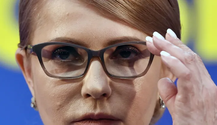 (FILES) Former Ukrainian Prime Minister and presidential candidate Yulia Tymoshenko adjusts her glasses as she prepares to deliver a speech at her campaign headquarters in Kiev, after the first round of Ukraine's presidential election on March 31, 2019. Yulia Tymoshenko, a former Ukrainian prime minister, confirmed that her party's offices had been raided during the night as part of a corruption investigation. (Photo by Sergei GAPON/AFP)