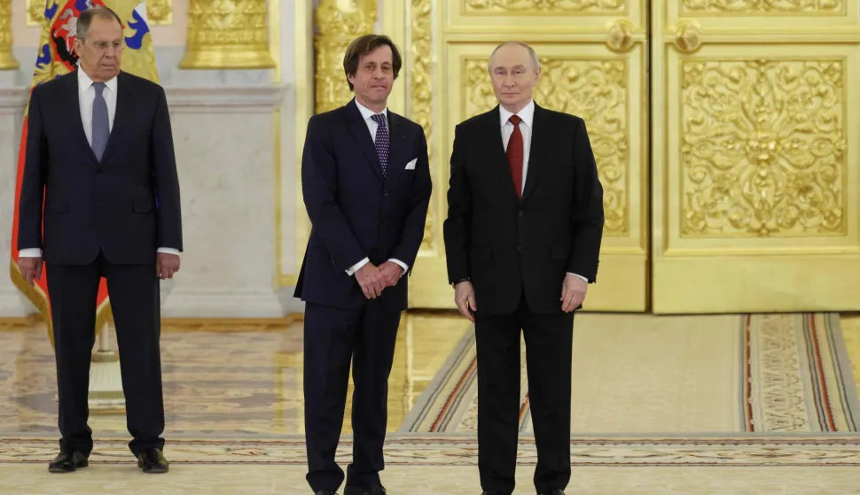Russia's President Vladimir Putin, Foreign Minister Sergei Lavrov and France?s Ambassador to Russia Nicolas de Riviere attend a ceremony to receive letters of credence from newly appointed foreign ambassadors at the Grand Kremlin Palace in Moscow on January 15, 2026. (Photo by Ramil Sitdikov/POOL/AFP)