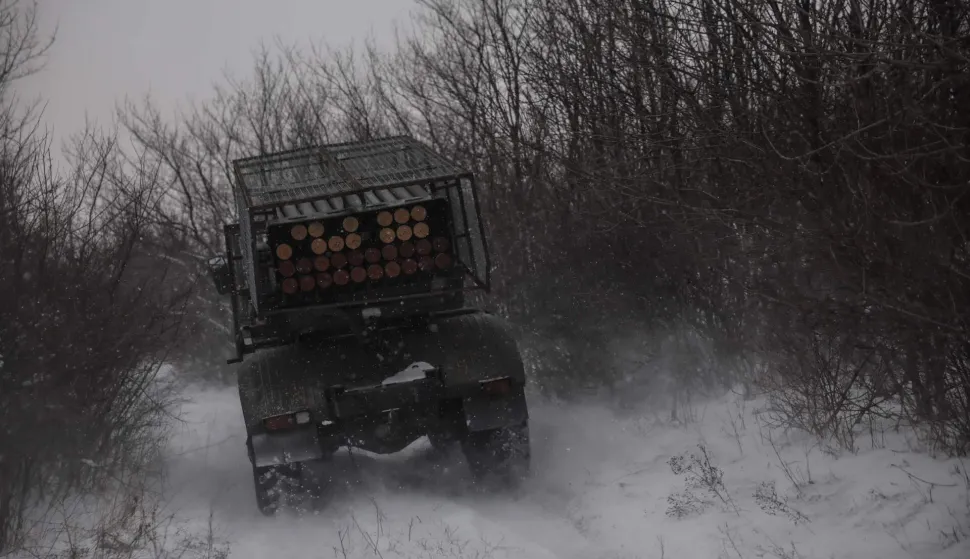 This handout photograph taken on January 15, 2026, and released on January 16, 2026, by the Press Service of the 24th Mechanized Brigade of Ukrainian Armed Forces shows Ukrainian servicemen riding a Bm-21 Grad MRLS to fire towards Russian positions near Chasiv Yar in the Donetsk region, amid the Russian invasion of Ukraine. (Photo by OLEG PETRASIUK/24th Mechanized Brigade of Ukrainian Armed Forces/AFP)/RESTRICTED TO EDITORIAL USE - MANDATORY CREDIT "AFP PHOTO/HANDOUT/ OLEG PETRASIUK/24th Mechanized Brigade of Ukrainian Armed Forces" - NO MARKETING NO ADVERTISING CAMPAIGNS - DISTRIBUTED AS A SERVICE TO CLIENTS