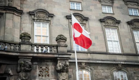 The Greenlandic flag called "Erfalasorput" flutters next to the main entrance of the Danish Parliament, Christiansborg, in Copenhagen, Denmark, on January 16, 2026. A meeting of Greenlandic, Danish, and US politicians is scheduled on January 16, 2026. (Photo by Sebastian Elias Uth/Ritzau Scanpix/AFP)/Denmark OUT