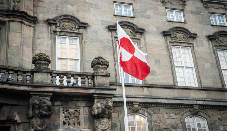 The Greenlandic flag called "Erfalasorput" flutters next to the main entrance of the Danish Parliament, Christiansborg, in Copenhagen, Denmark, on January 16, 2026. A meeting of Greenlandic, Danish, and US politicians is scheduled on January 16, 2026. (Photo by Sebastian Elias Uth/Ritzau Scanpix/AFP)/Denmark OUT