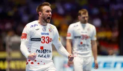 Croatia's centre back #33 Luka Cindric celebrates during the EHF Euro 2026 group E preliminary round handball match between Croatia and Georgia in Malmo, Sweden, on January 17, 2026. (Photo by Andreas Hillergren/TT/TT News Agency/AFP)/Sweden OUT
