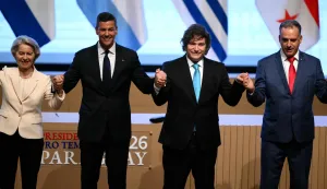 (L to R)European Commission President Ursula von der Leyen, Paraguay's President Santiago Pena, Argentina's President Javier Milei and Uruguay's President Yamandu Orsi pose for the official picture at the end of the signing ceremony of the trade agreement between the European Union and Mercosur, at the Gran Teatro Jose Asuncion Flores of Paraguay's Central Bank in Asuncion on January 17, 2026. The South American bloc Mercosur and the European Union on January 17 signed a major trade deal that has been 25 years in the making. (Photo by Luis ROBAYO/AFP)