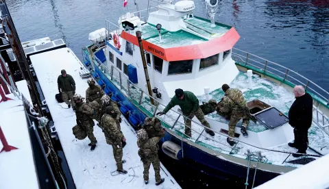 Danish soldiers disembark at the port in Nuuk, Greenland, on January 18, 2026. The Danish Defense will continue the increased presence with exercise activities together with a number of NATO allies in and around Greenland in 2026. This is done in cooperation with the Greenlandic authorities and the Greenlandic government, Naalakkersuisut, as stated by the Danish Defense. (Photo by Mads Claus Rasmussen/Ritzau Scanpix/AFP)/Denmark OUT
