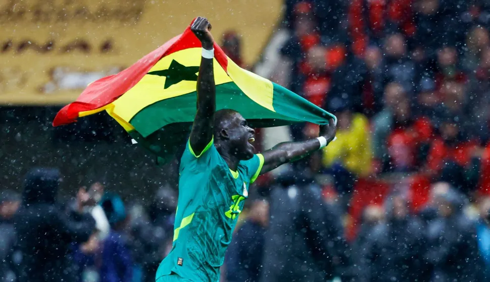 Senegal's defender #25 El Hadji Malick Diouf celebrates their victory at the end of the Africa Cup of Nations (CAN) final football match between Senegal and Morocco at the Prince Moulay Abdellah Stadium in Rabat on January 18, 2026. (Photo by Abdel Majid BZIOUAT/AFP)