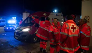 Members of the Red Cross work after a train accident in Adamuz, southern Spain, early on January 19, 2026. Spain reeled from a collision between two high-speed trains in the southern region of Andalusia that killed 21 people and injured more than 70, with the Prime Minister Pedro Sanchez lamenting a "night of deep pain" in the early hours of January 19, 2026. (Photo by Jorge GUERRERO/AFP)