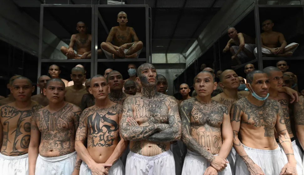 AFP PICTURES OF THE YEAR 2025Inmates remain in a cell at the Counter-Terrorism Confinement Centre (CECOT) mega-prison, where hundreds of members of the MS-13 and 18 Street gangs are being held, in Tecoluca, El Salvador on January 27, 2025.. The CECOT, the largest prison in Latin America and emblem of the war against gangs of the government of President Nayib Bukele, celebrates two years since it was inaugurated on February 1. (Photo by Marvin RECINOS/AFP)/AFP PICTURES OF THE YEAR 2025
