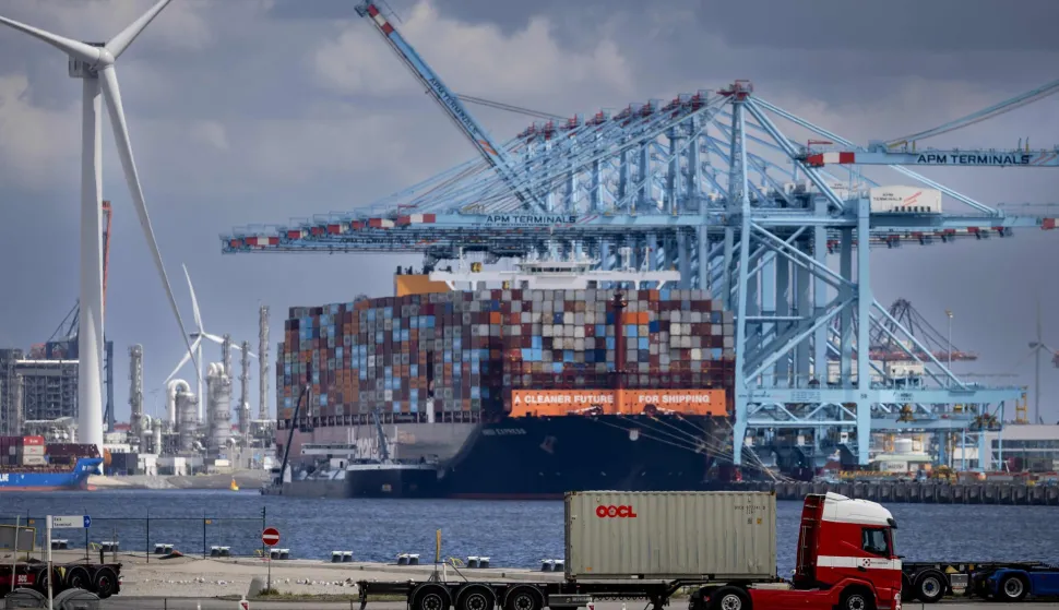 (FILES) A photo shows containers and transshipment at Maasvlakte, an industrial area in the port of Rotterdam, on July 21, 2025. France's President Emmanuel Macron, who will be "in contact with his European counterparts throughout the day", will call for the "activation of the EU's anti-coercion instrument" if Donald Trump's threats of customs surcharges are carried out, his entourage said on January 18, 2026. (Photo by Robin van Lonkhuijsen/ANP/AFP)