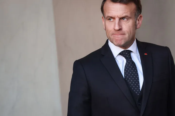France's President Emmanuel Macron reacts as he waits for the arrival of Chiefs of State at the Elysee Palace in Paris, on January 6, 2026, prior to the Coalition of the Willing summit on security guarantees for Ukraine. The summit of the group of Ukraine supporters dubbed the "Coalition of the Willing" is the latest of several meetings planned for the new year as diplomatic efforts to end Europe's deadliest conflict since World War II have gained pace in recent weeks. (Photo by Ludovic MARIN/AFP)
