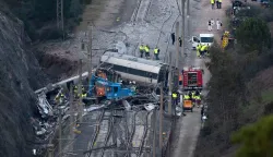Emergency services and investigators work on the site of a high-speed trains collision that killed at least 42 people, in Adamuz, southern Spain, on January 20, 2026. At least 42 people died and more than 120 injured in the deadliest train accident in Spain in over a decade. The crash happened on January 18 evening when a train operated by rail company Iryo travelling from Malaga to Madrid derailed near Adamuz, crossing onto the other track where it crashed into an oncoming train, which also derailed. (Photo by JORGE GUERRERO/AFP)