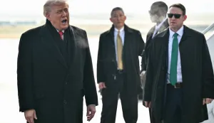 US President Donald Trump (L) reacts on the tarmac upon arrival at Zurich Airport on January 21, 2026. The World Economic Forum takes place in Davos from January 19 to January 23, 2026. (Photo by Mandel NGAN/AFP)