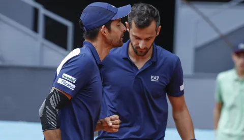epa12071285 Marcelo Arevalo (L) of El Salvador and Mate Pavic of Croatia talk as they play against Horacio Zeballos of Argentine and Marcel Granollers of Spain during the men's doubles final at the Mutua Madrid Open, in Madrid, Spain, 03 May 2025. EPA/Chema Moya