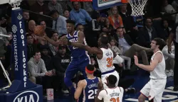 epa07280774 Philadelphia 76ers guard Jimmy Butler (L) is forced to pass by New York Knicks forward Noah Vonleh (C) in the first half of the NBA basketball game between the Philadelphia 76ers and the New York Knicks at Madison Square Garden in New York, New York, USA, 13 January 2019. EPA/PETER FOLEY SHUTTERSTOCK OUT