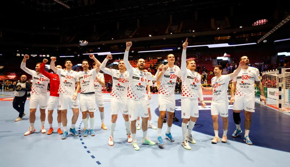 Croatia's team celebrates the victory over Iceland during the men's EHF Euro 2026 main round handball match Iceland v Croatia in Malmoe, Sweden, on January 23, 2026. (Photo by Andreas Hillergren/TT/various sources/AFP)/Sweden OUT