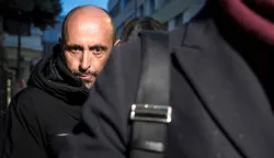 French co-owner of Le Constellation bar Jacques Moretti arrives for a hearing at the Office of the public prosecutor of the Canton of Valais, in Sion, on January 9, 2026. The co-owner of a Swiss bar which went up in flames during New Year celebrations in Crans-Montana has been placed in preventive detention for three months, a regional court said on January 12, 2026. (Photo by Fabrice COFFRINI/AFP)