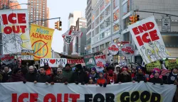 People hold banners and signs as they march in an "ICE Out" protest in New York on January 22, 2026 against US Immigration and Customs Enforcement (ICE). Demonstrations against ICE grew dramatically following the killing of Renee Nicole Good, 37, by an ICE officer in Minneapolis on January 7 as the Trump administration pressed operations to catch undocumented migrants. (Photo by ANGELA WEISS/AFP)