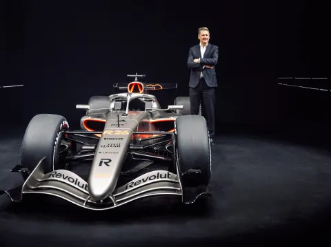 Audi CEO Gernot D&ouml;llner next to the Audi R26 in race livery