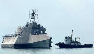 The US Navy's USS Cincinnati (LCS-20) littoral combat ship (L) arrives for a port call at the Ream Naval base, located in Cambodia's southern coast in Preah Sihanouk province, on January 24, 2026. (Photo by Suy SE/AFP)