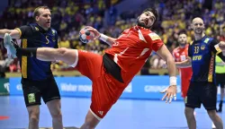Hungary's pivot #45 Miklos Rosta scores during the men's EHF Euro 2026 main round handball match Sweden v Hungary in Malmoe, Sweden, on January 27, 2026. (Photo by Johan Nilsson/TT/TT NEWS AGENCY/AFP)/Sweden OUT