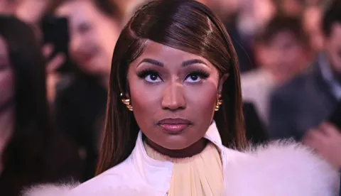 Trinidadian rapper and singer-songwriter Nicki Minaj looks on as US President Donald Trump speaks about 'Trump Accounts' at the Andrew W. Mellon Auditorium in Washington, DC, on January 28, 2026. (Photo by Brendan SMIALOWSKI/AFP)