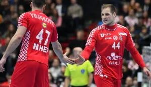 epa07290563 Jakov Vrankovic (L) of Croatia and Kresimir Kozina of Croatia celebrate during the IHF Men's Handball World Championship match between Croatia and Bahrain in Munich, Germany, 16 January 2019. EPA/PHILIPP GUELLAND
