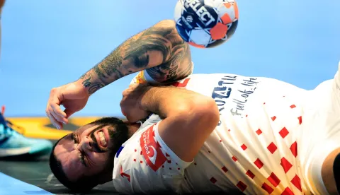Leon Croatia's pivot #52 Leon Susnja reacts injured on the floor during the EHF Euro 2026 group E preliminary round handball match between Croatia and Georgia in Malmo, Sweden, on January 17, 2026. (Photo by Andreas Hillergren/TT/TT News Agency/AFP)/Sweden OUT