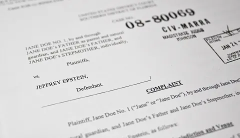 This photo illustration taken in Washington, DC, on December 19, 2025 shows a court document after the US Justice Department began releasing the long-awaited records from the investigation into the politically explosive case of convicted sex offender Jeffrey Epstein. (Photo by Mandel NGAN/AFP)