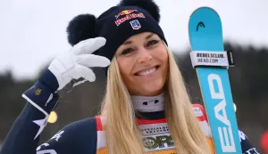 US' Lindsey Vonn, third, poses after the podium ceremony of the Women's Downhill event of FIS Alpine Skiing World Cup in Tarvisio, Italy on January 17, 2026. Italy's Nicol Delago won the race ahead of Germany's Kira Weidle, second, and US' Lindsey Vonn, third. (Photo by Marco BERTORELLO/AFP)