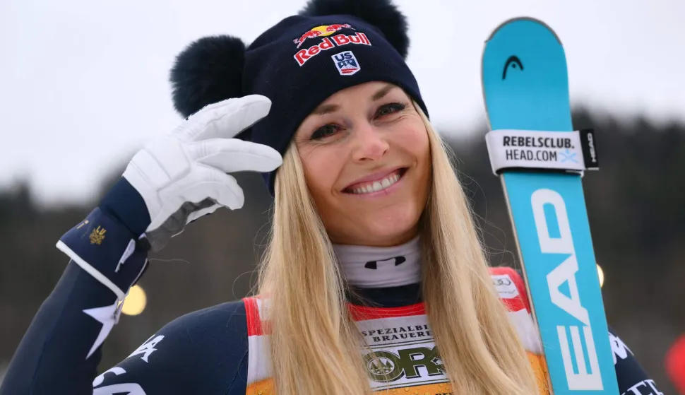 US' Lindsey Vonn, third, poses after the podium ceremony of the Women's Downhill event of FIS Alpine Skiing World Cup in Tarvisio, Italy on January 17, 2026. Italy's Nicol Delago won the race ahead of Germany's Kira Weidle, second, and US' Lindsey Vonn, third. (Photo by Marco BERTORELLO/AFP)