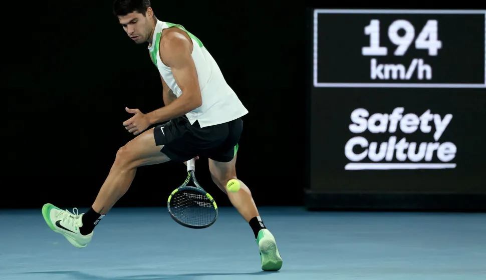 Spain's Carlos Alcaraz hits a return to Serbia's Novak Djokovic during their men's singles final match on day fifteen of the Australian Open tennis tournament in Melbourne on February 1, 2026. (Photo by Martin KEEP/AFP)/-- IMAGE RESTRICTED TO EDITORIAL USE - STRICTLY NO COMMERCIAL USE --