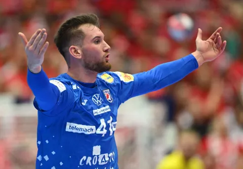 Croatia's centre back #41 Tin Lucin celebrates after scoring during the men's EHF Euro 2026 third place handball match Iceland vs Croatia in Herning, Denmark, on February 1, 2026. (Photo by Jonathan Nackstrand/AFP)